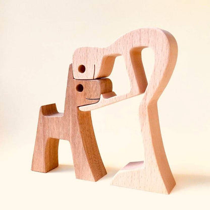 Holzskulptur von Mann und Hund