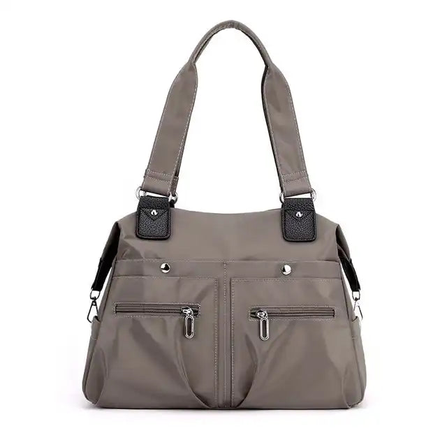 JoannStyle | Wasserdichte Umhängetasche mit gepolstertem Laptopfach